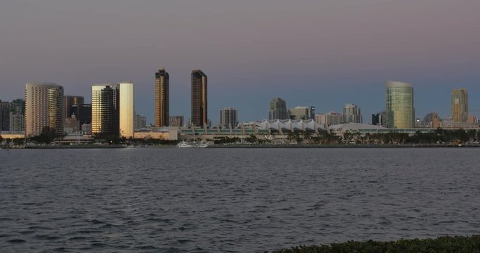 SAN DIEGO, CA - Circa February, 2017 - An evening establishing shot of the San Diego skyline with the San Diego Convention Center in the foreground.  	