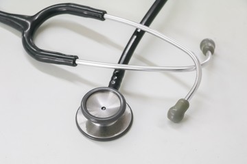 medical stethoscope in Clinic, old used long-standing on the table with copy space :Select focus with shallow depth of field.