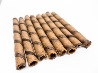 Isolated - Chocolate Wafer Roll on white background, shallow depth of field