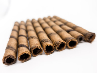 Isolated - Chocolate Wafer Roll on white background, shallow depth of field