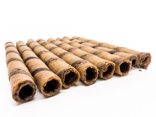 Isolated - Chocolate Wafer Roll on white background, shallow depth of field
