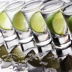 Vodka, gin, tequila with ice and lime. Alcoholic cocktail or non-alcoholic cocktail. selectiv focus...