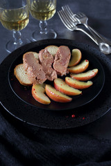 Fried foie gras with apples and two glasses of white wine