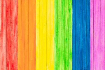 An old rustic wooden board with rainbow colors for gay pride. Gay flag.