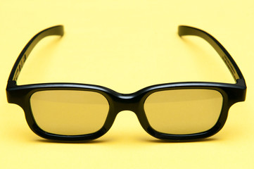 Glasses with black frame on yellow background