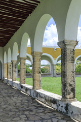 arches and columns in the courtyard of the convent of San Antonio of Padua in Izamal, Yucatan, Mexico.