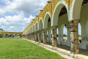 arches and columns in the courtyard of the convent of San Antonio of Padua in Izamal, Yucatan, Mexico.