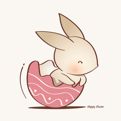 Easter bunny inside a cracked Easter egg