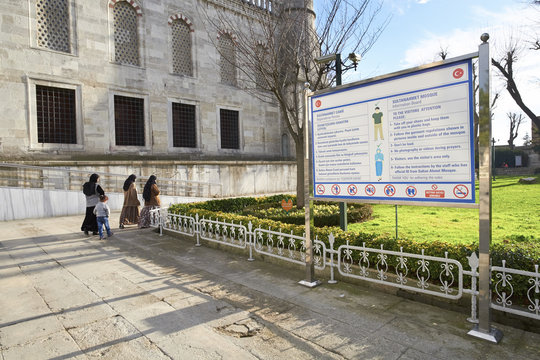 ISTANBUL, TURKEY - FEBRUARY 12, 2014: Three women and a child arriving at the Blue Mosque at Istanbul in Turkey.