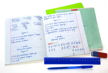 School math notebook with ruler and pen