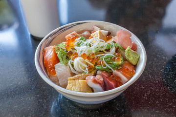 Oriental Japanese food, Bowl of mixed sashimi topped on Japanese rice.