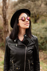 Pretty brunette girl with leather jacket