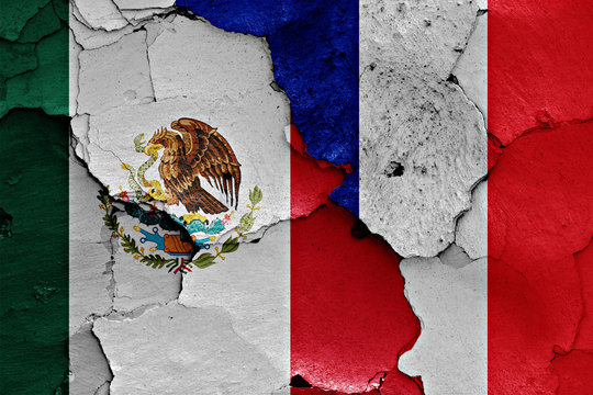flags of Mexico and France painted on cracked wall