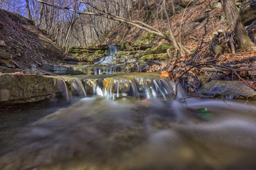 close view of waterfall in small river in the mountain
