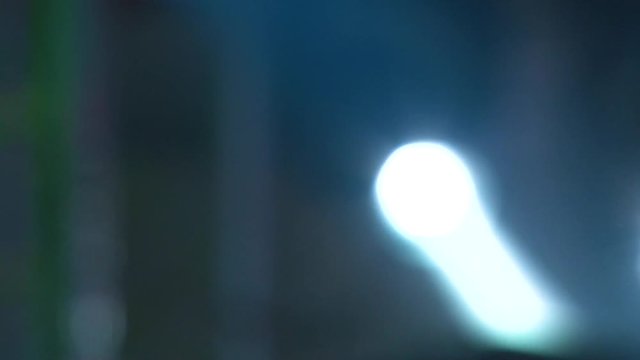 Blurred light at the concert. Stroboscopes shine, colorful light.
