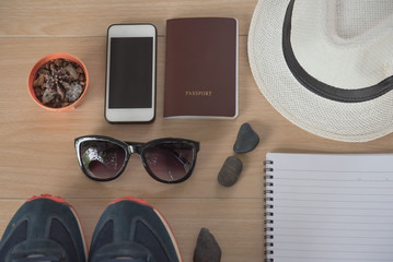Top view Concept travel accessories. Hat, book, phone, shoes, passport, sunglasses,  on wooden background. - 139944224