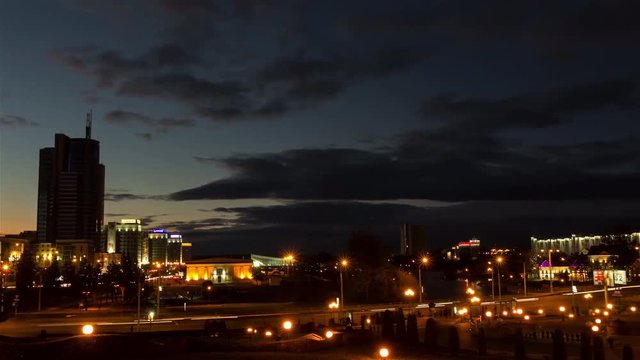 City from day to night. Zoom out, time-lapse shot