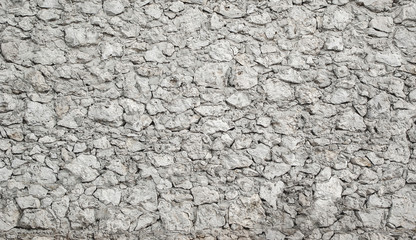 Molded concrete wall with white limestone stone