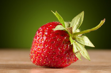photo of delicious strawberries on wooden table