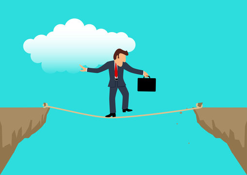 Businessman walking carefully on rope crossing the ravine
