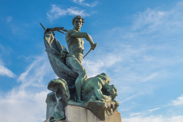 Turin (Torino), Italy - February 15, 2017: Bronze statue depicting Valor on the Battlefield was added to the Ponte Umberto I bridge in Turin, Italy by Luigi Contratti in 1911 and blue sky