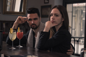 young man looking at woman, looking away