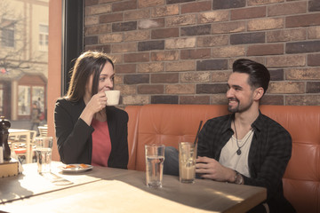 young woman drinking cafe, man looking at each other, face to face
