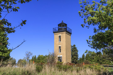 Fototapeta na wymiar Peninsula Point Lighthouse on Stonington Peninsula on Lake Michigan, Delta County, Michigan, USA