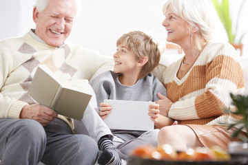 Boy sitting with tablet device