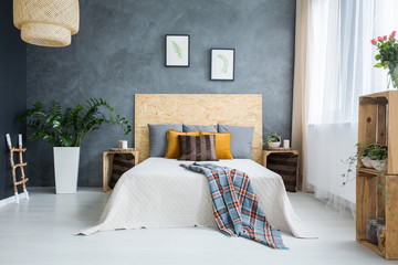 Bedroom with concrete wall