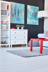 Room with navy walls and red table