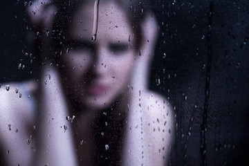 Blured image of depressed girl