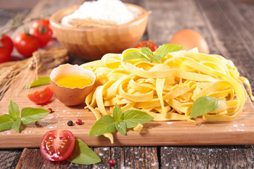 raw tagliatelle and ingredient