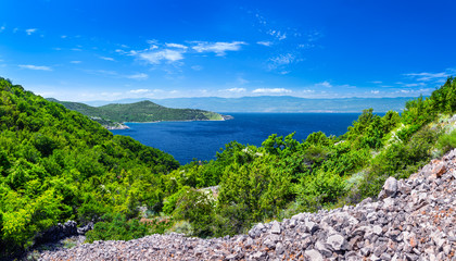 Fototapeta na wymiar Wonderful romantic summer afternoon landscape panorama coastline Adriatic sea. The magical clear transparent azure water in the bay. Krk island. Croatia. Europe.