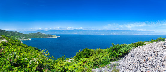 Wonderful romantic summer afternoon landscape panorama coastline Adriatic sea. The magical clear transparent azure water in the bay. Krk island. Croatia. Europe.