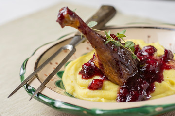 Roasted Duck Leg with Mashed Potatoes, Apples and Red Currants in Red Wine Sauce