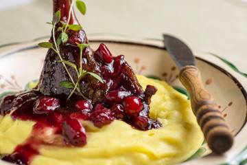 Roasted Duck Leg with Mashed Potatoes, Apples and Red Currants in Red Wine Sauce