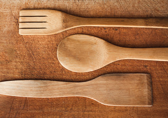 Wooden Serving spoons and fork on wooden surface