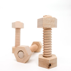 Isolated - Wooden Bolt and nut, shallow depth of field