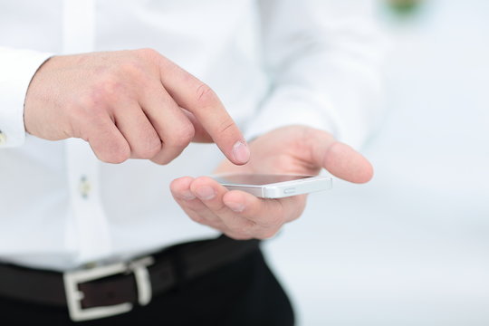 Mock up of a man holding device and touching screen