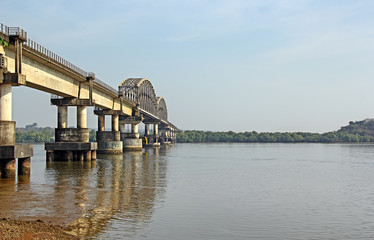 Fototapeta premium Indian railway bridge across the river Zuari in Goa, India