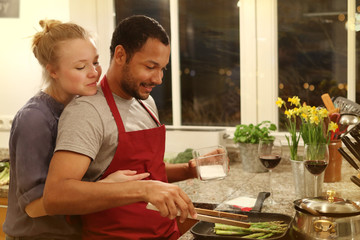 Happy couple cooking together