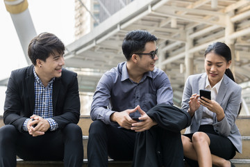 Business people discuss outside office