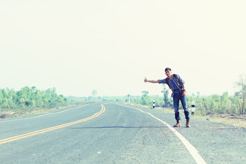 Traveler with backpack need stop car