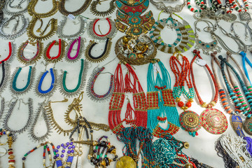 Street shop selling metal women ornaments or jewelries like necklace, chains, bangles, rings, bracelets. Chennai India Feb 25 2017