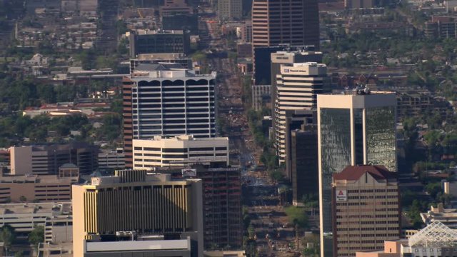Flight past downtown Phoenix with wide view of layered skyscrapers. Shot in 2007.
