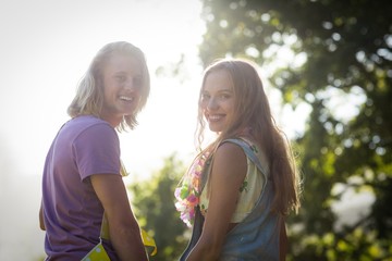 Young couple smiling in park