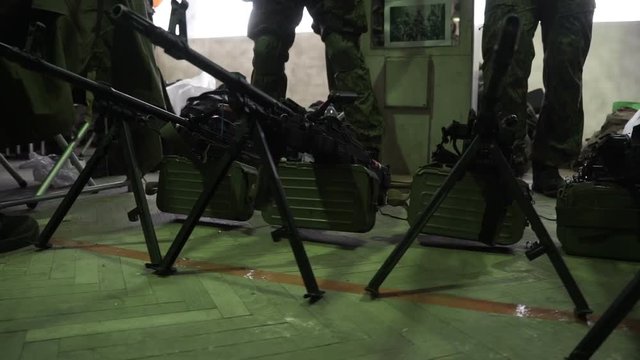 The machine-gun is on the bipods on the floor