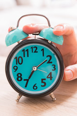 Hand on the alarm clock