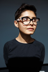 Fototapeta na wymiar Portrait of young attractive brunette girl in glasses.